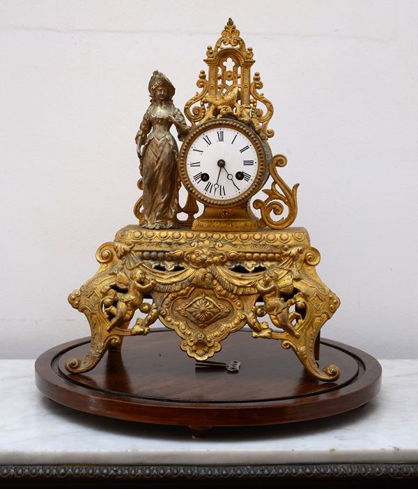 Orologio da camino in bronzo dorato