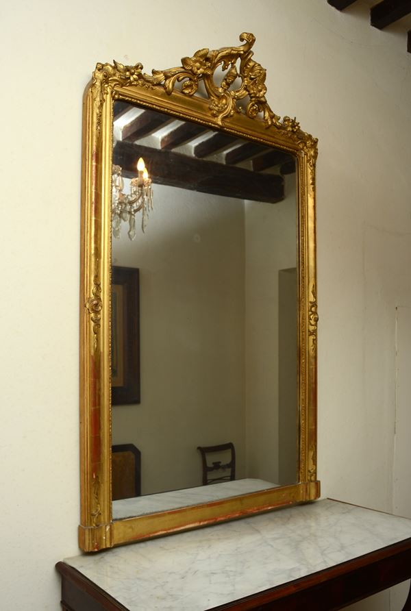 Specchiera in legno intagliato e dorato